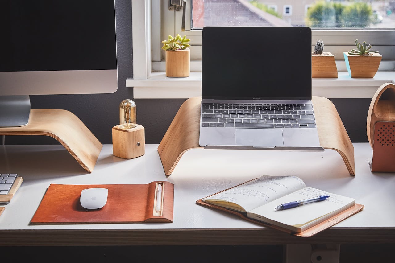 hero-img-01 A stylish and contemporary home office setup with laptop and desk accessories.